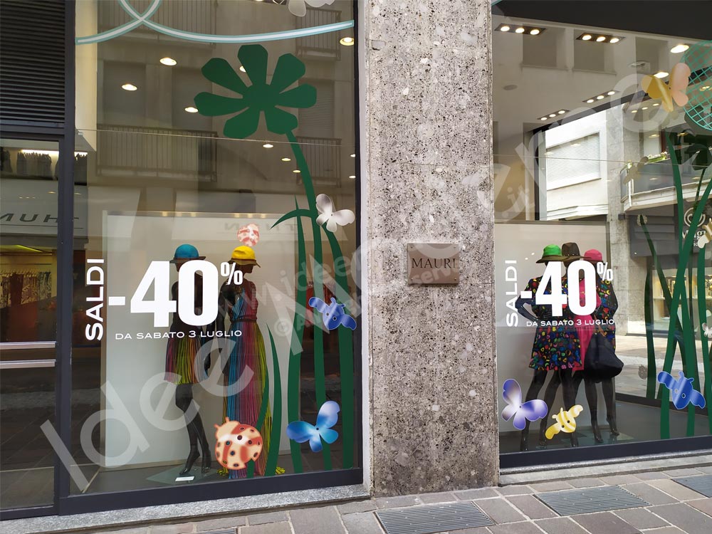 Scritte saldi adesive su vetrina negozio Varese Milano