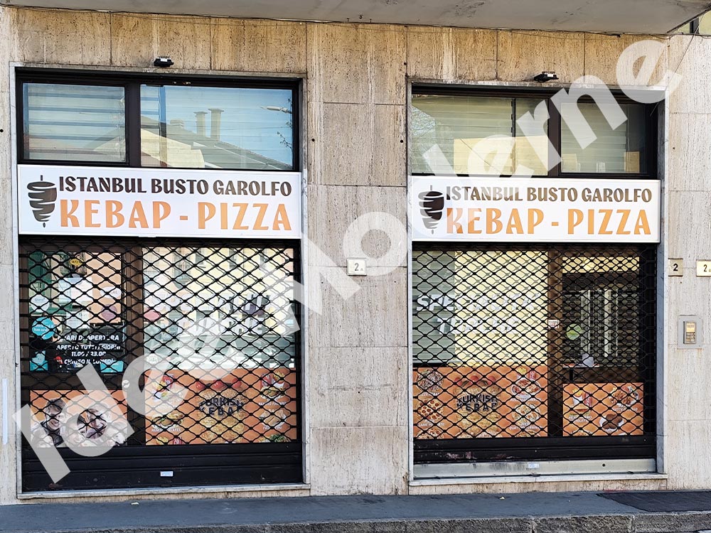 Installazione insegna pubblicitaria a bandiera Varese